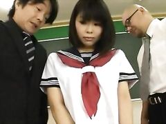 Shameless schoolgirl Minami Machida sucks hard cocks gets anal explored.
