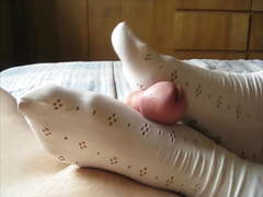 Pretty white sockjob cum shot