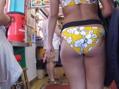 Cute nerdy girl in yellow bikini