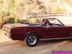 Country les beauties scissoring outdoors